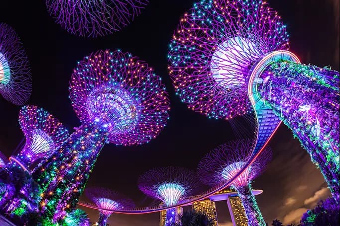 Glowing tree sculptures at night in Singapore